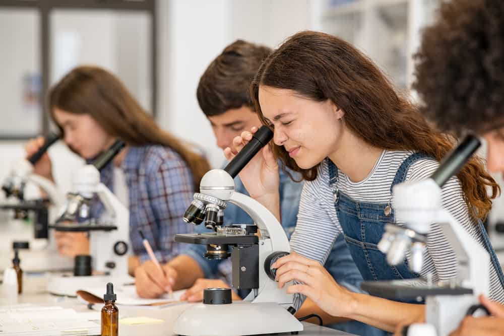 Students-in-science-classroom-using-microscopes
