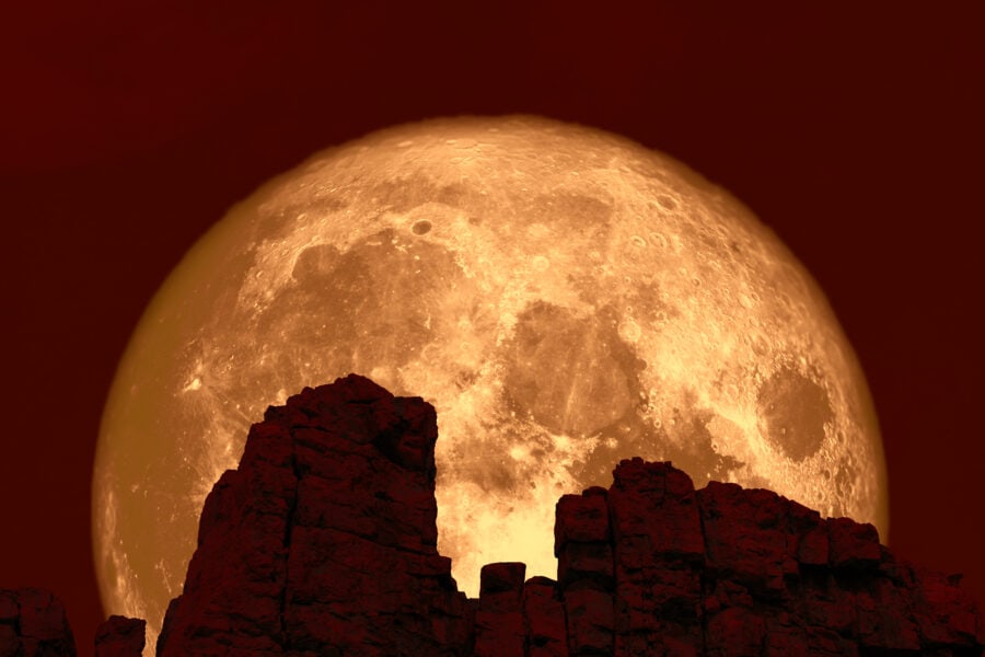 A sleek telescope with a starry night sky in the background.